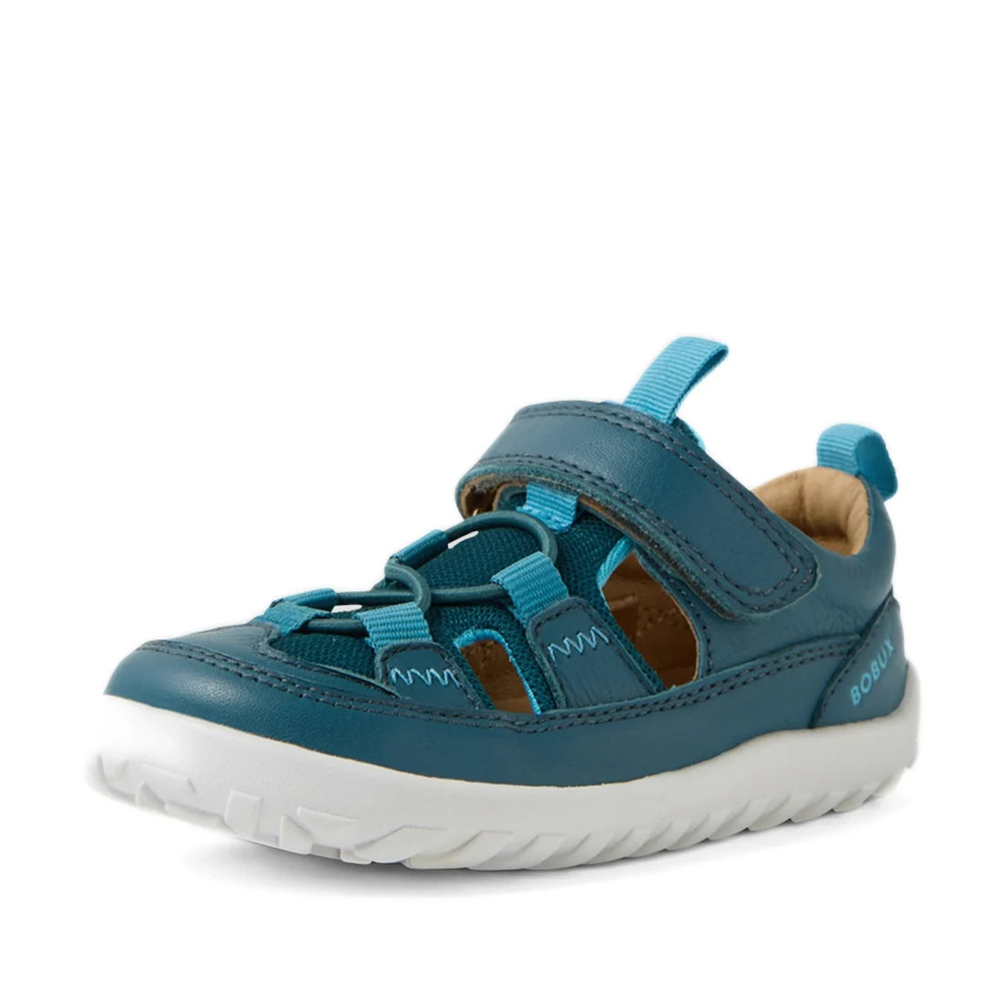 A Mediterranean Green and white kids’ leather sandal, the Bobux IW Iwalk Rocky features a closed toe, Velcro strap, elastic laces, and a rugged white sole. This barefoot sandal offers flexible comfort and displays Bobux branding on the side heel., 9420074
