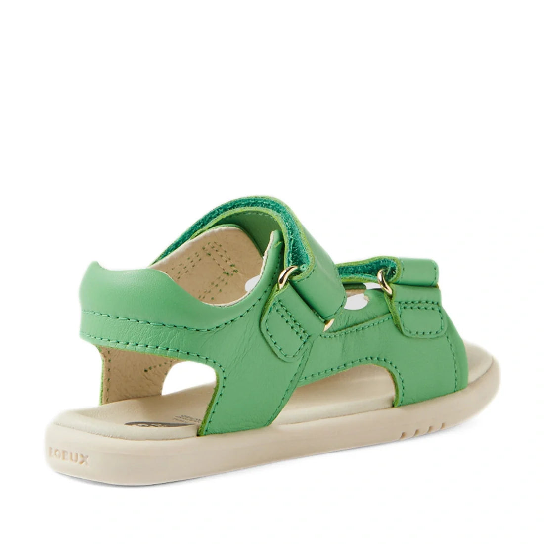 The Bobux IWalk Strand Sandal in Retro Green is shown angled from the back side, featuring an open heel and toe, gold buckles, and a beige sole. Made from washable leather with adjustable straps, these sandals are perfect for active toddlers., 94200748577