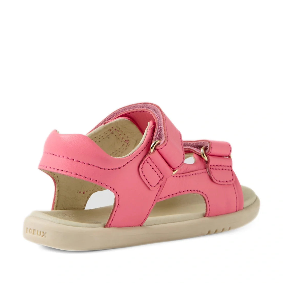 The Bobux IWalk Strand Sandal in Pink Lemonade for toddlers features a soft leather upper, a beige sole, open heel, and adjustable Velcro straps, as seen from an angled view highlighting the back and side., 9420074857651, 9420074857668, 9420074857675, 942