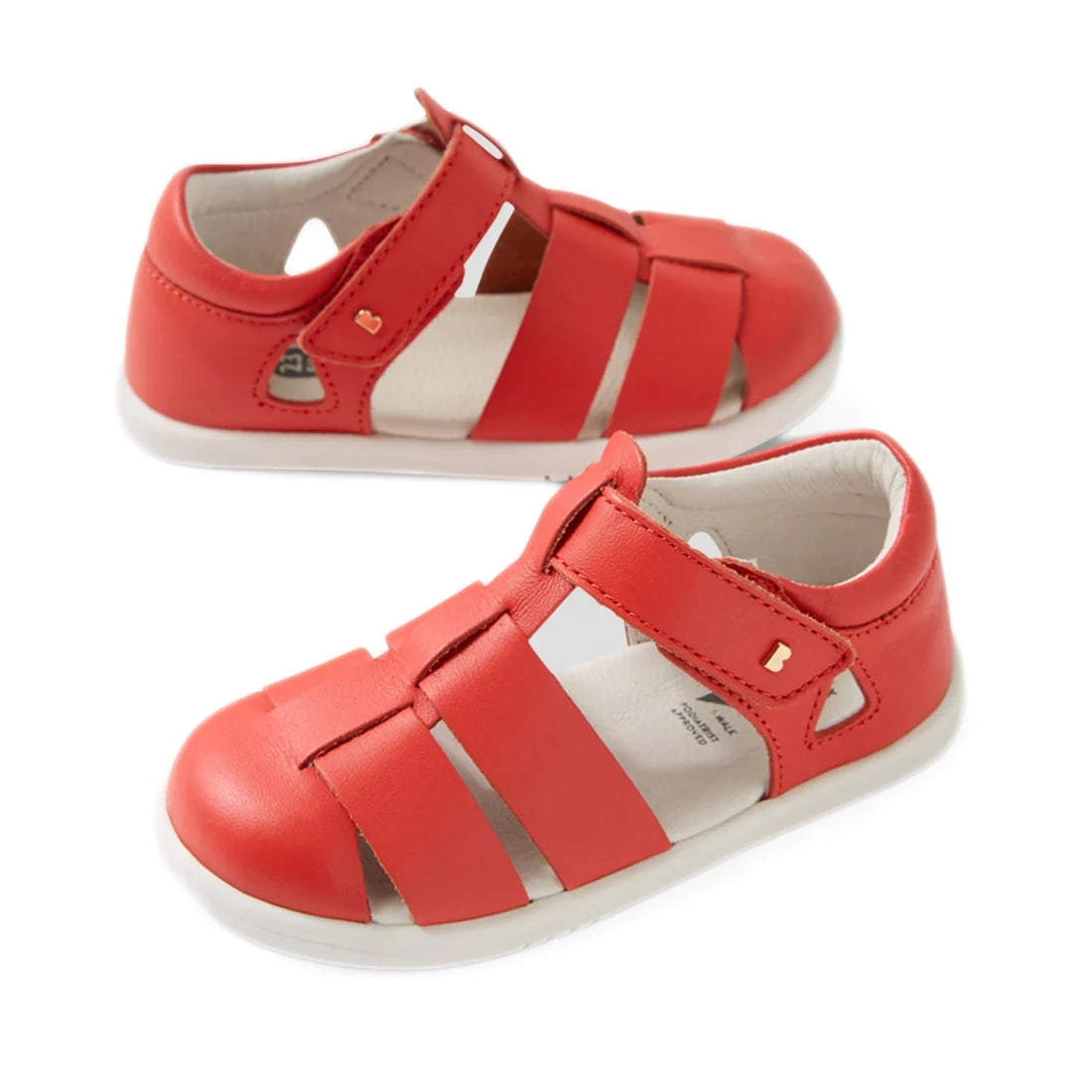 A pair of Bobux IWalk Tidal Sandal Grenadine Red Closed Toe Toddlers, featuring closed toes, velcro straps, and white soles, displayed from two angles on a white background. These water-friendly sandals for toddlers are designed to provide comfort and dur