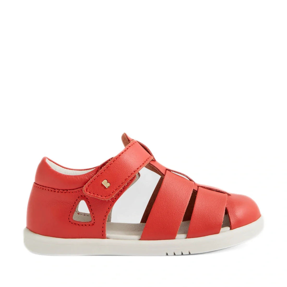 The Bobux IWalk Tidal Sandal in Grenadine Red is a closed-toe toddler sandal featuring a white sole, velcro strap, and side cut-out details, shown from a side profile. Water-friendly and designed for active days, these sandals combine protection and style