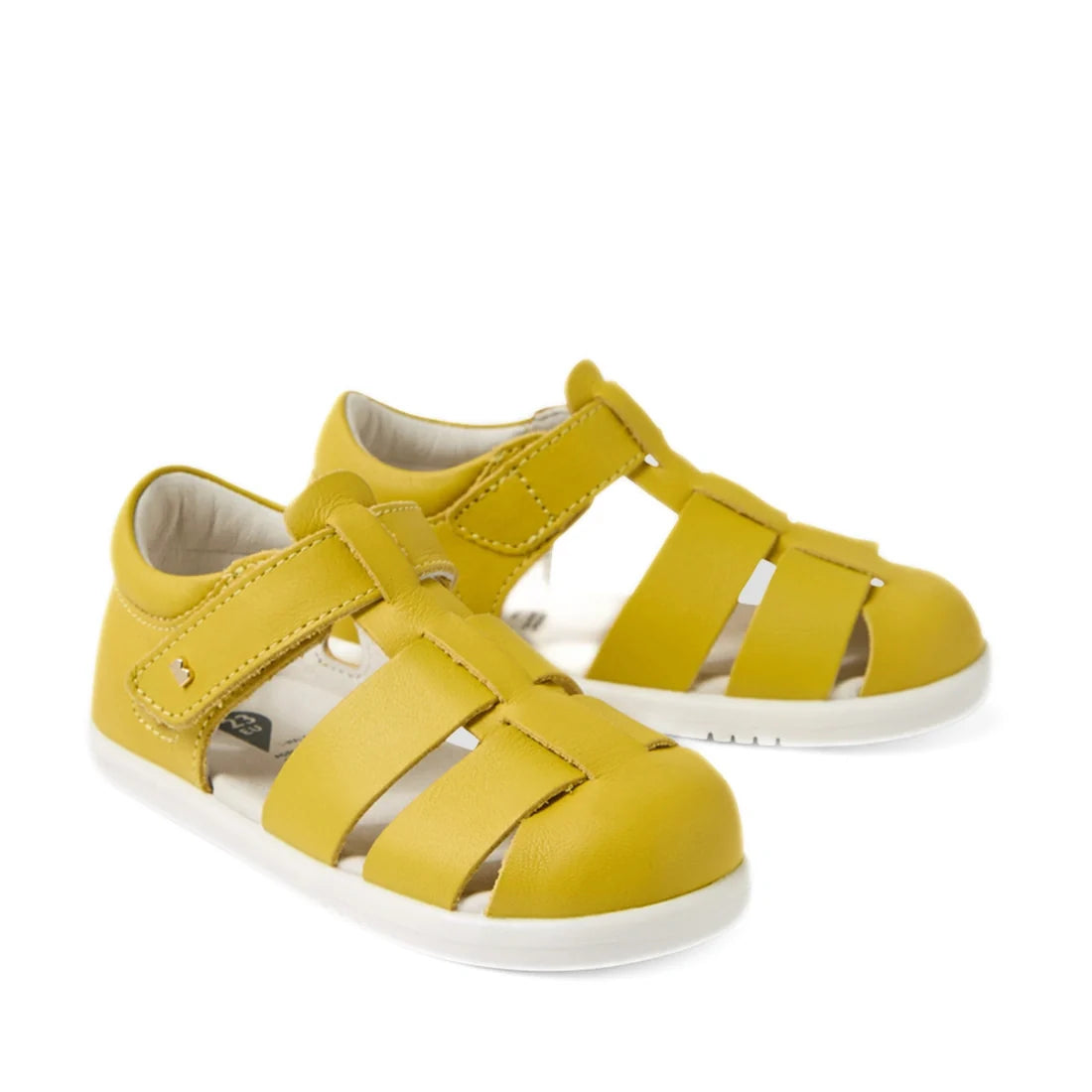 A pair of Bobux IWalk Tidal Sandal Mango Mint Closed Toe Toddlers, crafted from water-friendly leather with a closed-toe design, white soles, and Velcro straps, displayed against a white background.