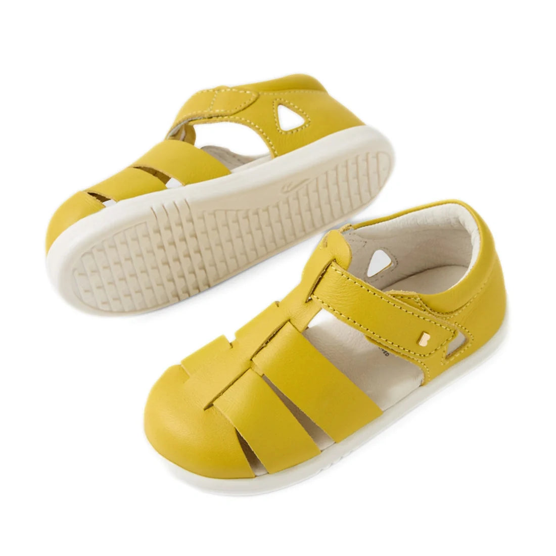 A pair of Bobux IWalk Tidal Sandal Mango Mint Closed Toe Toddlers featuring a vibrant yellow design, white soles, Velcro straps for easy adjustment, and a comfortable fit. Crafted from water-friendly leather, these sandals are ideal for active toddlers—on