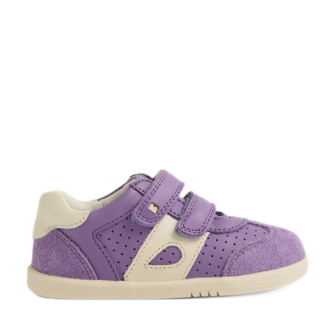 The Bobux IW Iwalk Toddlers Titan Purple Haze Leather Trainer is a children’s sneaker in purple and cream, featuring perforated accents, a suede toe, dual adjustable Velcro straps, and a flat slip-resistant rubber sole. Shown in profile facing right on a 