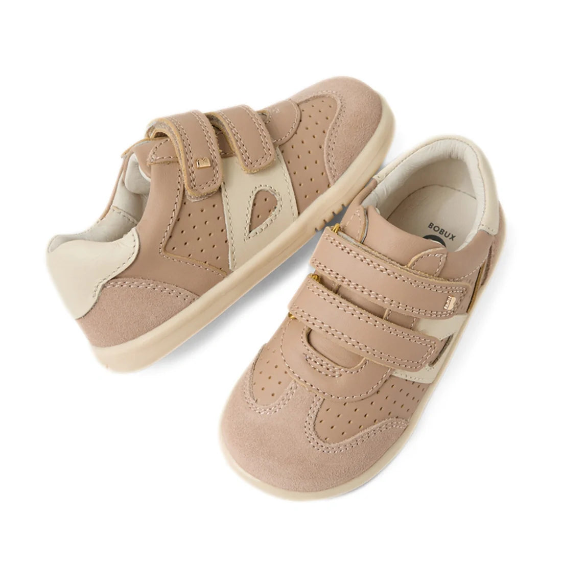 A pair of Bobux IW Iwalk Toddlers Titan Warm Taupe Leather Trainers featuring beige accents, perforated details, and two adjustable hook-and-loop straps, displayed on a white background.