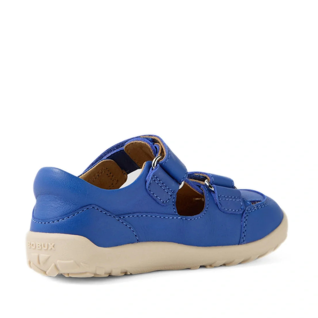 The Bobux IW Iwalk Troop Toddlers Leather Sandal in Dazzling Blue is a barefoot shoe designed for growing feet, featuring blue leather, a closed toe, hook-and-loop strap, cutout sides, and a beige rubber sole—shown from a side angle on a white background.