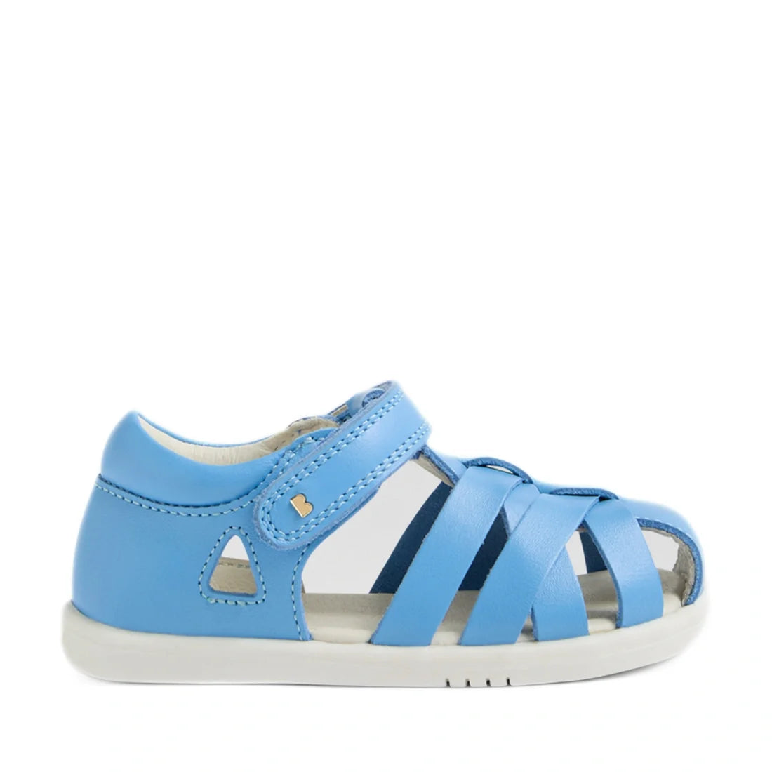 Introducing the Bobux Iwalk IW Tropicana II Baltic Sea Blue Leather Sandal: a toddler’s sandal crafted from premium blue leather, featuring a closed heel, open toe, and white sole. The design offers closed-toe protection with side cut-out details and a Ve