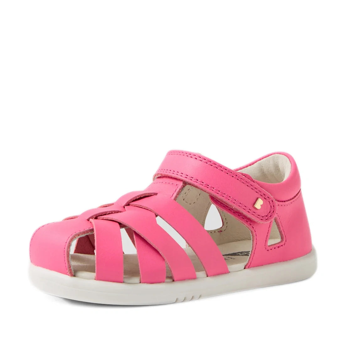 A pink lemonade children’s sandal with a closed toe, cutout sides, and a white sole, the Bobux Iwalk IW Tropicana II Pink Lemonade Leather Sandal is perfect for little feet. These closed-toe sandals feature a Velcro strap across the top for easy fastening
