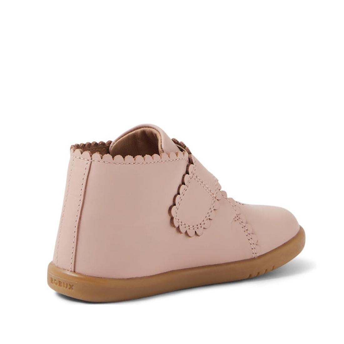 The Bobux IW Iwalk Willow Leather Boot in Cameo Rose Pink is a pale pink toddler shoe with scalloped edges, an adjustable Velcro strap, and a light brown rubber sole, shown from the back and side on a white background., 9420068545120, 9420068545137, 94200