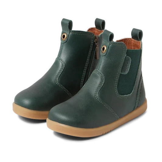 The Bobux Iwalk Jodhpur Boot Rainforest Green 630867 is a children's premium leather boot with tan rubber soles, side elastic panels, and front and back pull tabs, shown against a white background.
