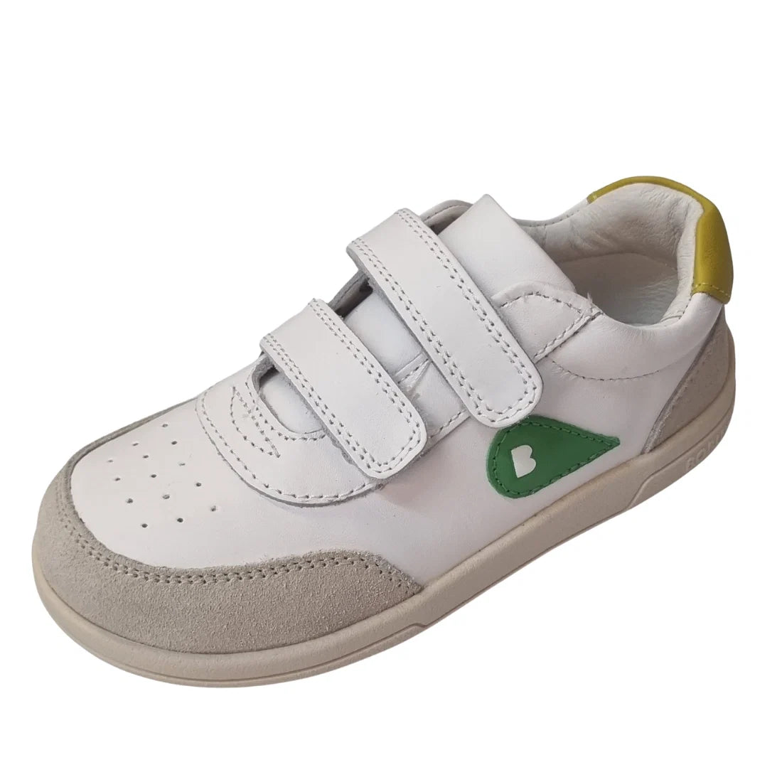 The Bobux KP Kids Plus Champ Leather Sneaker in White Green features soft white leather, two convenient hook and loop straps for easy fastening, a beige toe cap, a green side detail with a ‘B’, and a yellow accent on the heel—making these sturdy sneakers 