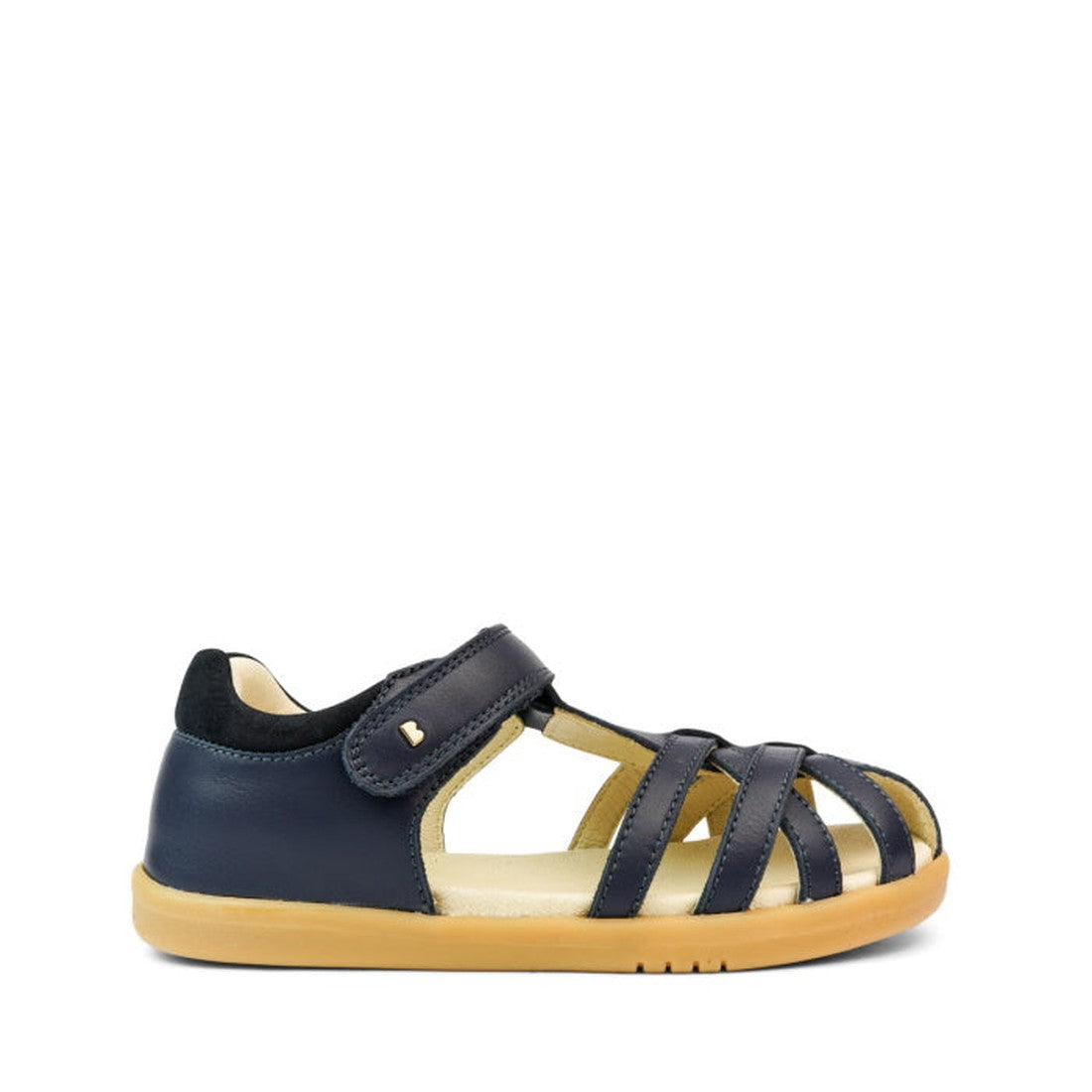 The Bobux Kids + Plus Girls Cross Jump Navy Leather Sandal 837003 features navy leather, a closed heel, open toe, multiple adjustable straps with Velcro fastening, a tan rubber sole, and is set against a plain white background., 9420062083659, 94200620836