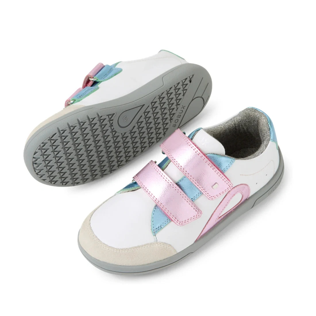 Introducing the Bobux KP Kids Plus Blaze Leather Sneaker in White Pink Metallic: this pair features soft white leather with playful pink, blue, and green accents, plus eye-catching metallic pink Velcro straps. One sneaker is displayed upright while the ot