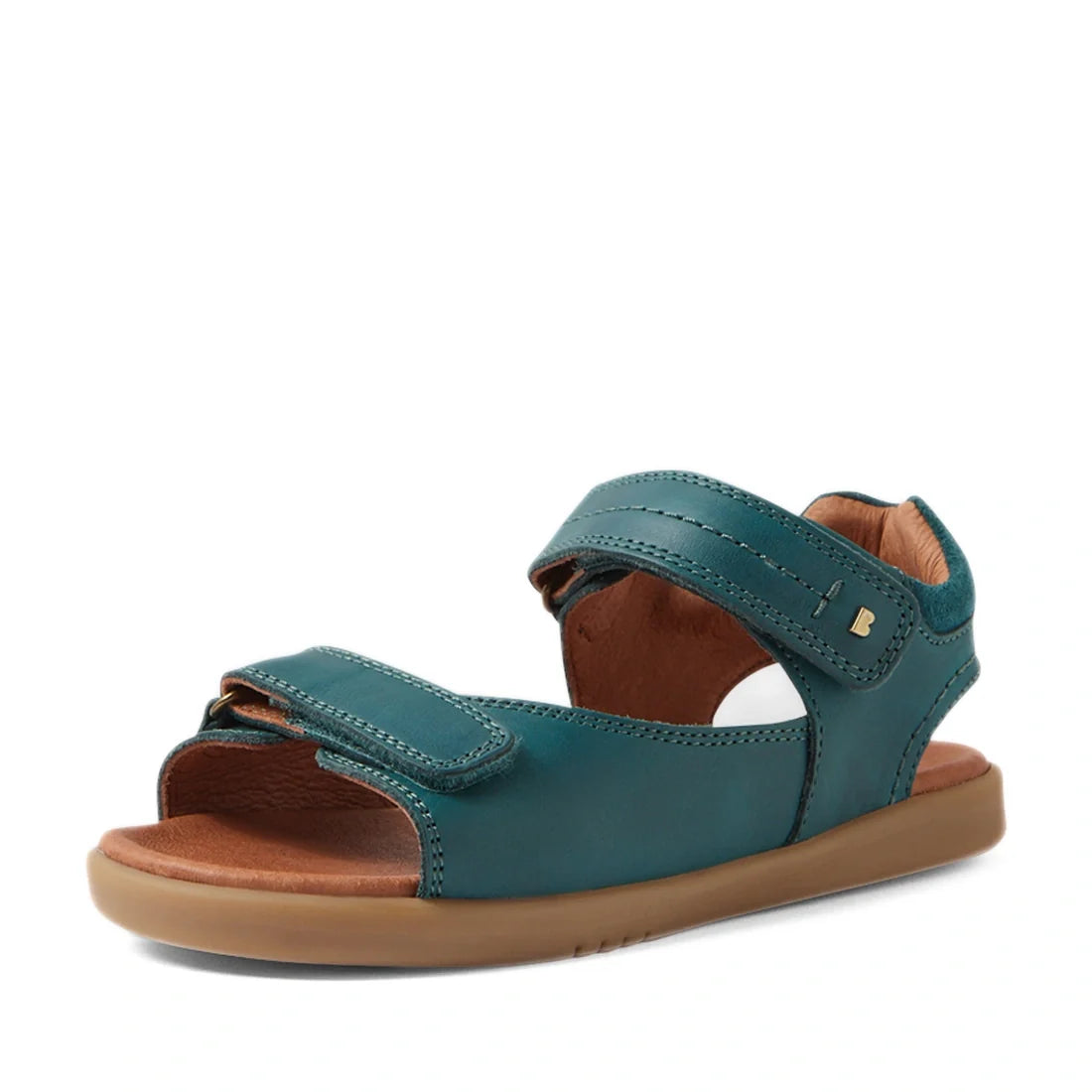 Introducing the Bobux KP Kids Plus Driftwood Leather Sandal in Mediterranean Green—a stylish open-toe sandal from the Bobux Driftwood Juniors collection. This sandal features two adjustable Velcro straps, a cushioned brown insole, and a light brown flat s