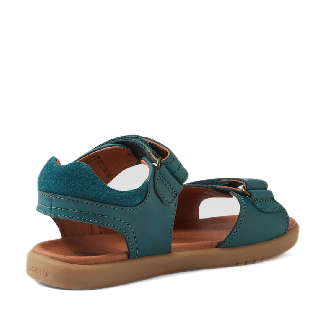 A Mediterranean Green Bobux KP Kids Plus Driftwood Leather Sandal, designed with adjustable straps and a cushioned brown sole, is shown at an angle highlighting the back and side—ideal for boys searching for stylish and comfortable leather sandals for eve