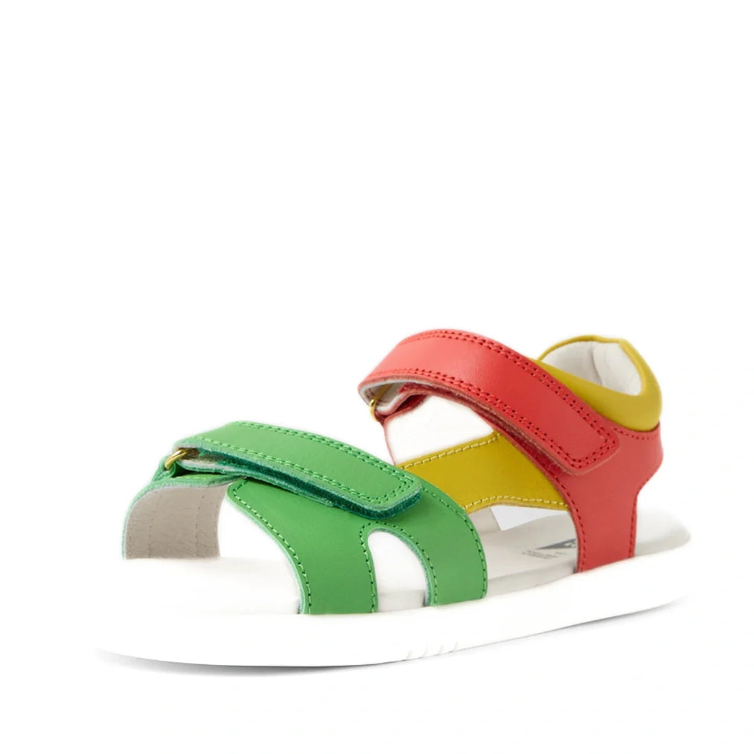 Bobux KP Kids Plus Dune Leather Sandal Grenadine Red—a child’s sandal crafted from leather, featuring adjustable green, yellow, and red straps on a white sole and shown from an angle for a vibrant look., 9420074855688, 9420074855695, 9420074855701, 942007