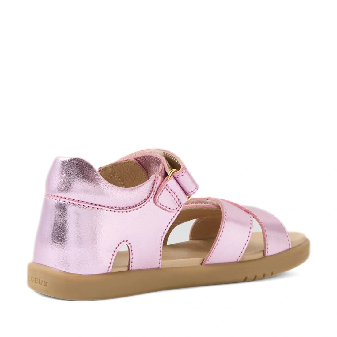Introducing the Bobux KP Kids Plus Flora Leather Sandal in Pink Lemonade: these children’s sandals feature a metallic pink finish with an open-toe design, adjustable Velcro strap, and a durable brown rubber sole, displayed from both the back and side view