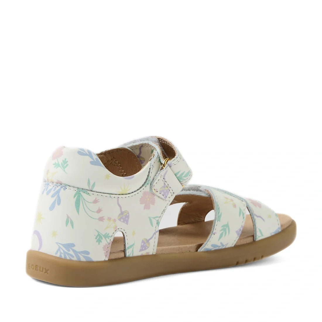 The Bobux KP Kids Plus Flora Leather Sandal in White Floral is an adjustable child’s sandal featuring a pastel flower print, open toe, ankle strap, and sturdy tan rubber sole—shown from the side and slightly behind., 9420074846754, 9420074846761, 94200748