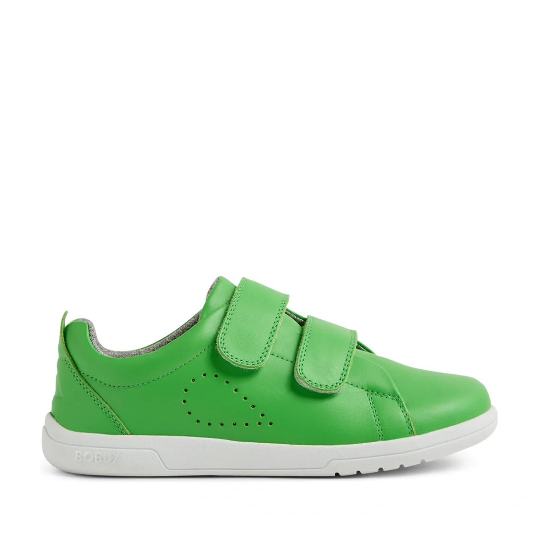 The Bobux KP Kids Plus Grass Court 2 II Leather Sneaker in Retro Green features a bright green leather upper with two Velcro straps, a perforated dot pattern on the side, gray interior lining, and a white rubber sole. These wide fit sneakers are part of t
