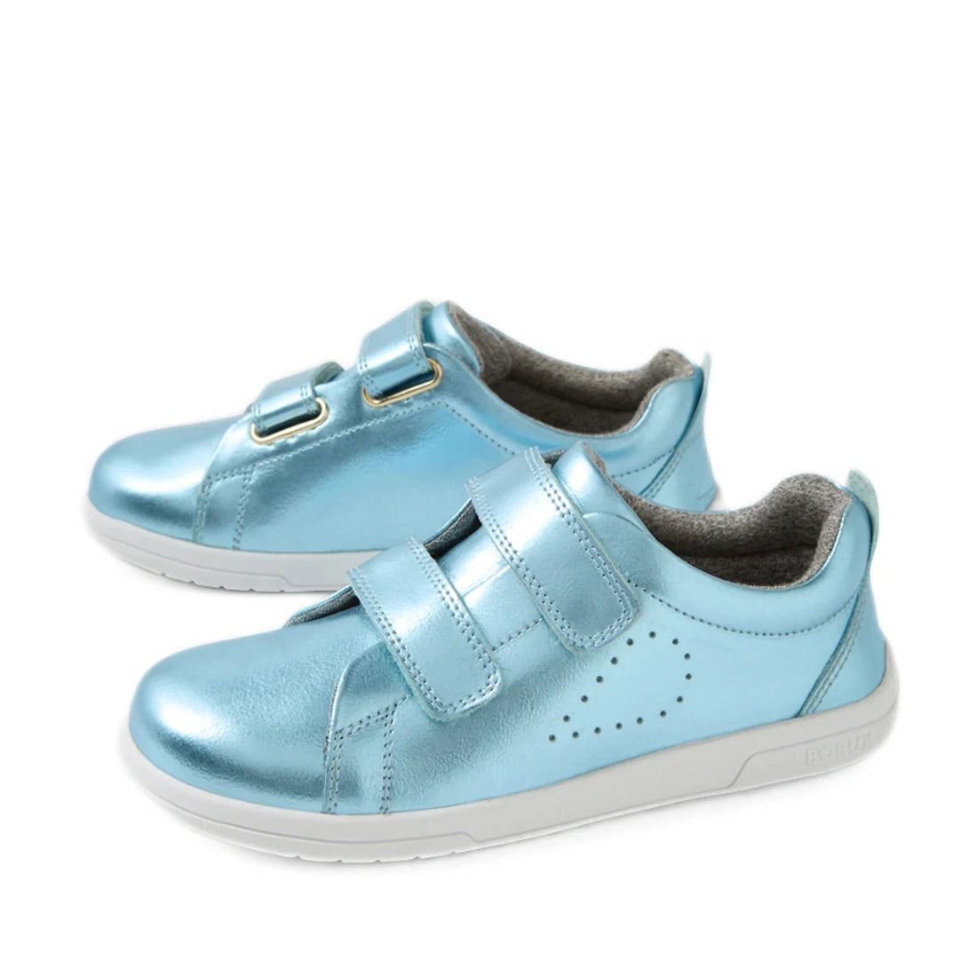 Introducing the Bobux KP Kids Plus Grass Court 2 II Leather Sneaker in Jelly Mint Metallic Blue: these shiny, light blue leather sneakers for children feature a wide fit, classic white soles, two secure hook-and-loop straps, and subtle side perforations. 