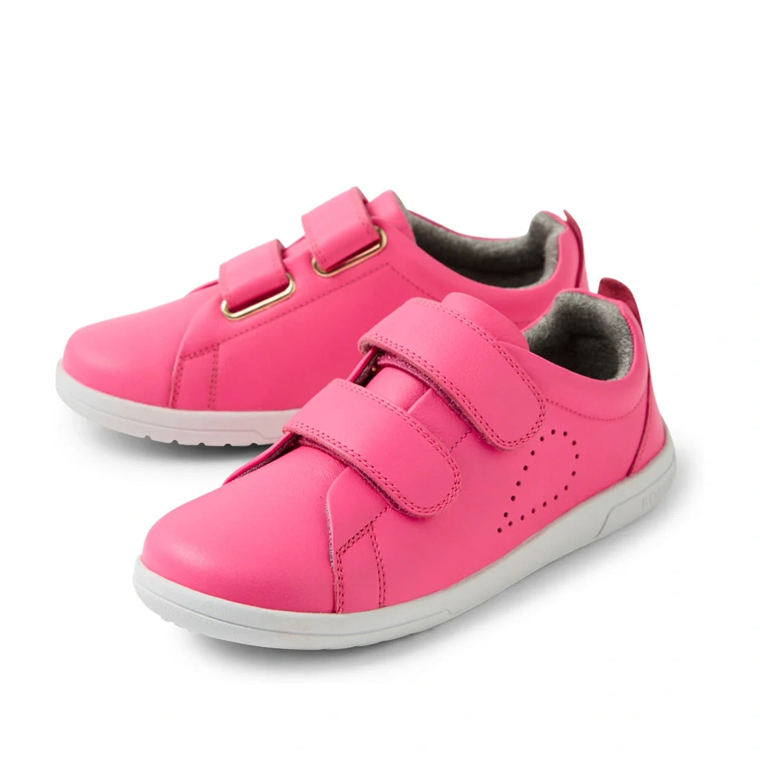 Introducing the Bobux KP Kids Plus Grass Court 2 II Leather Sneaker in Pink Lemonade—wide fit kids’ sneakers made from vibrant pink leather, featuring durable white soles and two easy Velcro straps. Inspired by the Bobux Grass Court collection, these trai