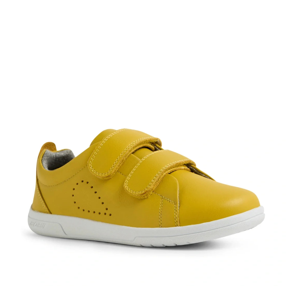 A Bobux KP Kids Plus Grass Court 2 II Leather Sneaker in Mango Mint, featuring yellow leather with two velcro straps, a white sole, and a small perforated heart design on the side, is shown against a white background. This stylish wide-fit shoe is perfect