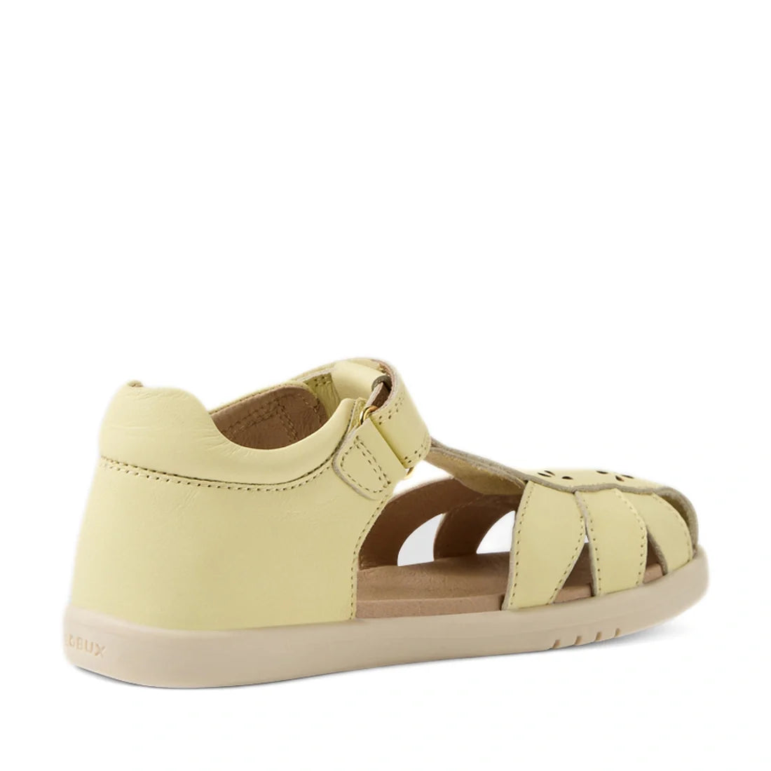 Introducing the Bobux Kid+ Plus KP Holly Wax Yellow Closed Toe Sandal: a pale yellow children’s sandal inspired by the classic Bobux Holly design, featuring a closed heel, open sides, and a convenient Velcro strap. This stylish leather sandal is finished 