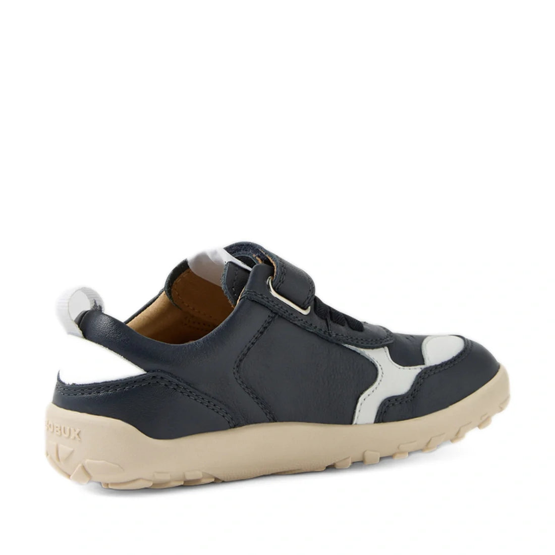 Rear view of the Bobux Kid+ Plus KP Neo Leather Sneaker Navy Alpha: a children’s navy blue and white leather sneaker featuring a barefoot-shaped toebox, velcro strap, tan rubber sole, and white accents., 9420074847690, 9420074847706, 9420074847713, 942007