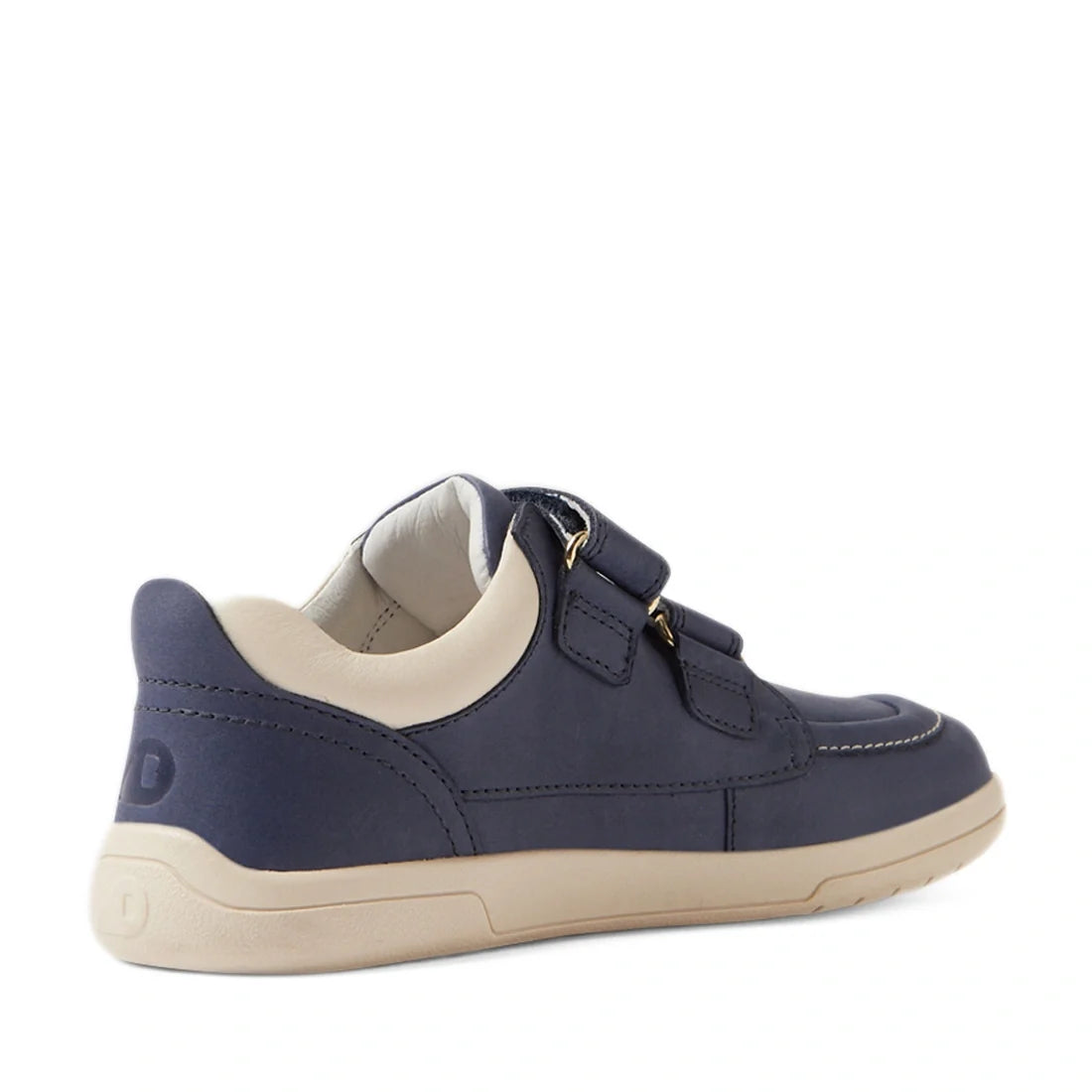 The Bobux Kid+ Plus KP Oakley Leather Sneaker in Vintage Indigo Blue is a kids’ leather sneaker with a navy blue upper, beige sole and interior, twin-strap Velcro closures, and contrast stitching, showcased from an angle to highlight its side and back for