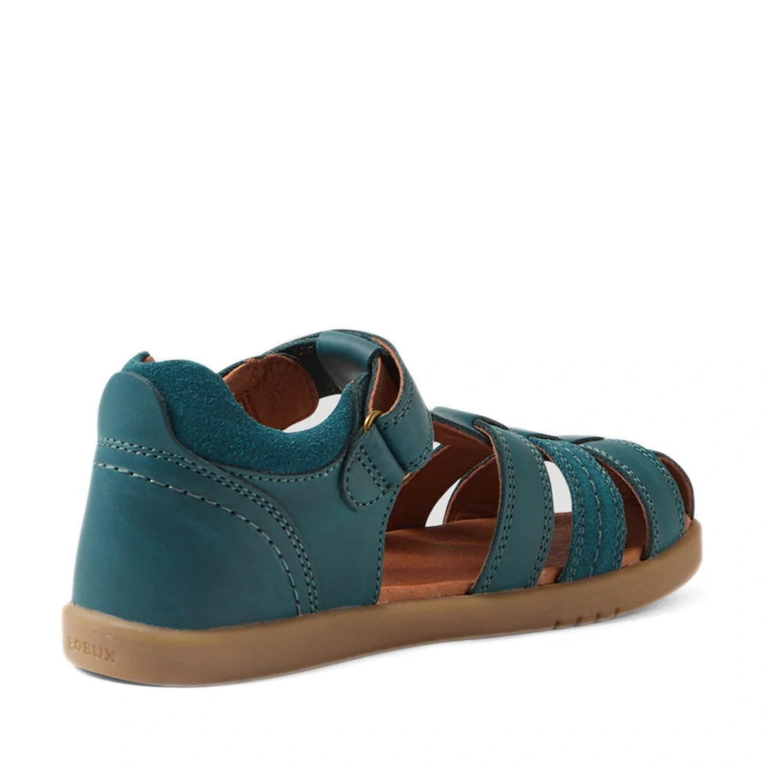 The Bobux Kid+ Plus Roam Mediterranean Green Closed Toe Sandal features a teal leather upper with closed heels, open sides, toe straps, and a brown sole. Designed for comfort and durability, these summer sandals offer a secure hook-and-loop closure—perfec