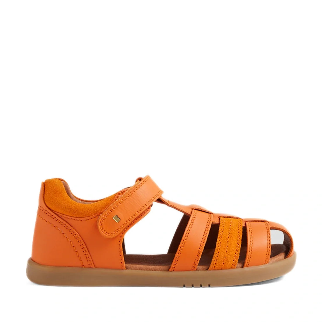A single Bobux Kid+ Plus Roam Orange Peel Closed Toe Sandal is displayed on a white background; this orange leather children's sandal features a closed heel, open toe, three front straps, and a hook-and-loop ankle strap—making it an ideal summer shoe for 