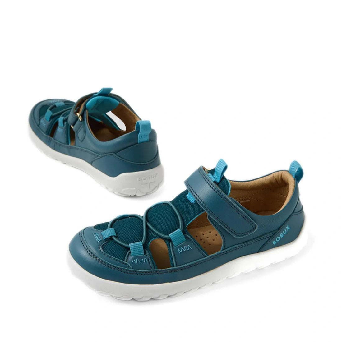 Two Mediterranean Green and white Bobux Kid+ KP Rocky Leather Closed Toe Sandals for kids, featuring Velcro straps along with mesh and leather accents, are displayed on a white background, showing both a side and angled view.