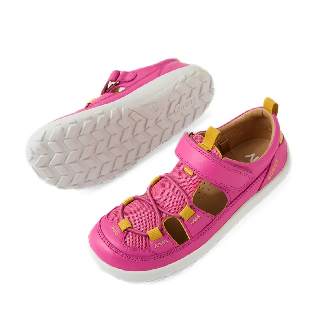 A pair of Bobux Kid+ KP Rocky Leather Closed Toe Sandal Rose Violet Barefoot sandals for kids in pink and yellow leather, featuring white textured soles, mesh panels, and cutout sides. Designed with a barefoot-like zero drop for natural movement, one shoe