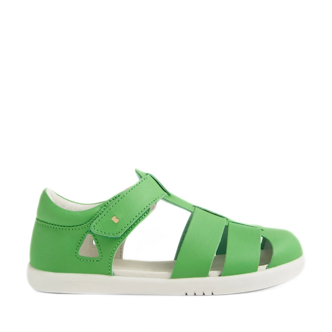 Displayed on a white background, the Bobux Kid + Plus Tidal Closed Toe Quick Dry Sandal in Retro Green features a classic design with cutout straps, a secure Velcro ankle closure, and a contrasting white sole. Reminiscent of traditional Tidal sandals, thi