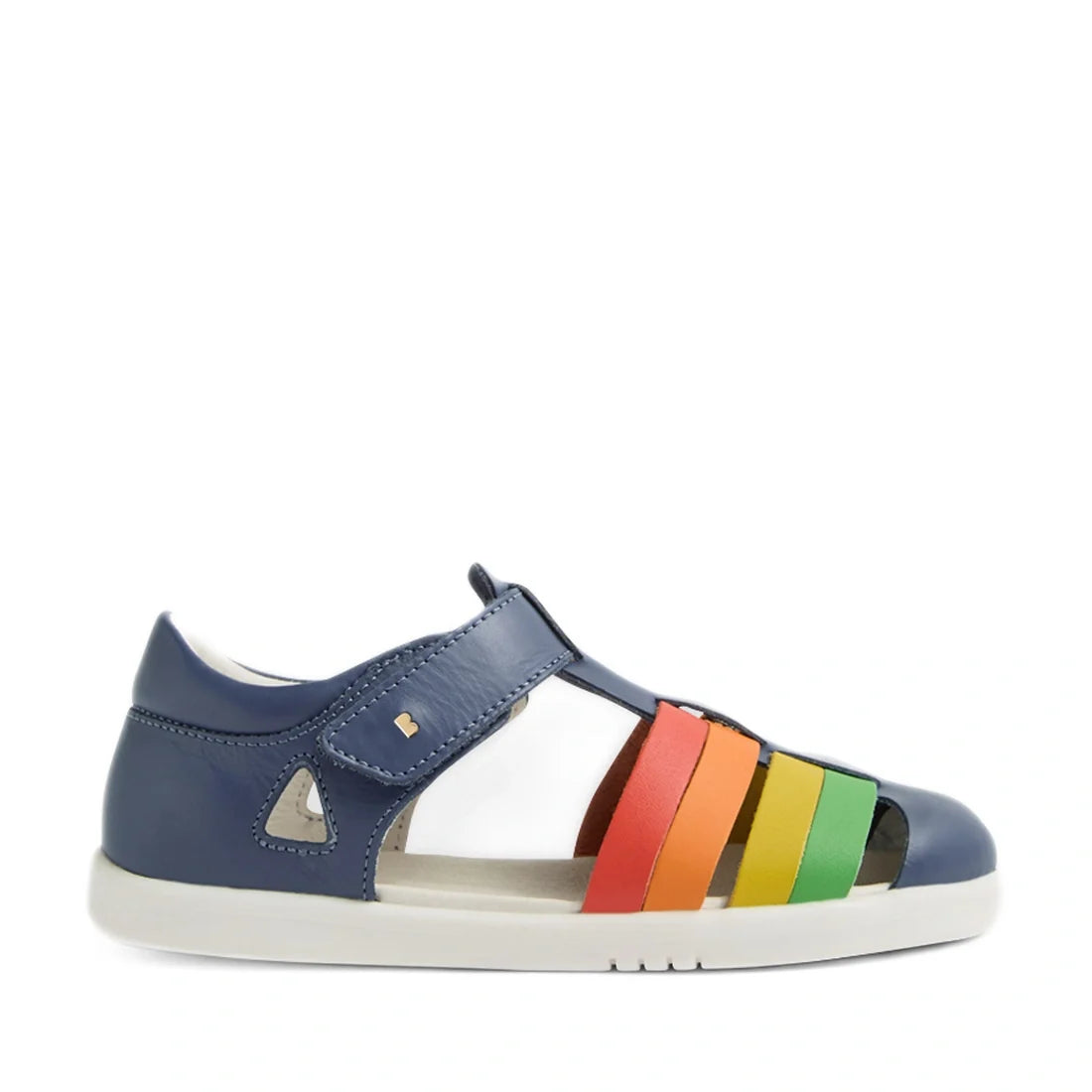 Introducing the Bobux Kid + Plus Tidal Closed Toe Quick Dry Sandal in Vintage Indigo Blue. Featuring a vibrant design with a white sole and colorful red, orange, yellow, and green straps across the top, these children’s sandals offer both comfort and styl
