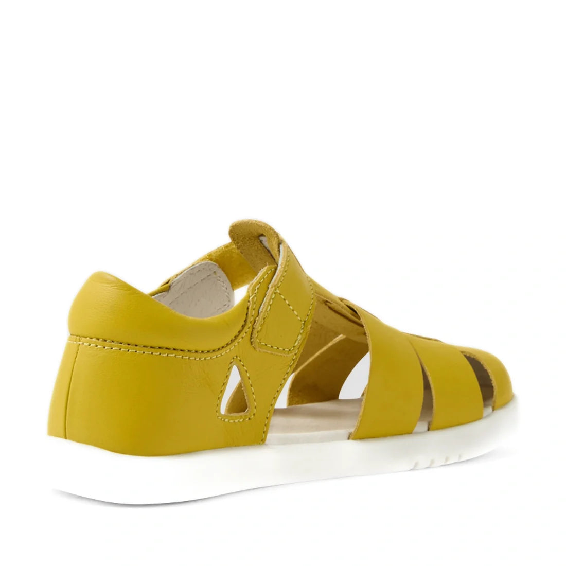 The Bobux Kid+ Plus Tidal Closed Toe Quick Dry Sandal in Mango Mint is a yellow closed-toe sandal with a white sole, open sides, a closed heel, and a Velcro strap—perfect water-friendly footwear for active days—shown here from the back left angle against 