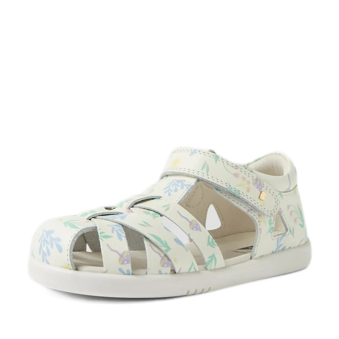 The Bobux Kids Plus KP Tropicana II White Floral Quick Dry Sandal is a stylish white leather kids' sandal featuring a charming floral pattern, closed-toe design, cut-out sides, and a convenient Velcro strap. Inspired by the popular Bobux Tropicana sandals