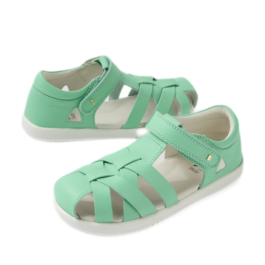 A pair of Bobux Kids Plus KP Tropicana II Jelly Mint Quick Dry Sandals in mint, featuring closed toes, white soles, and Velcro straps, displayed on a white background.