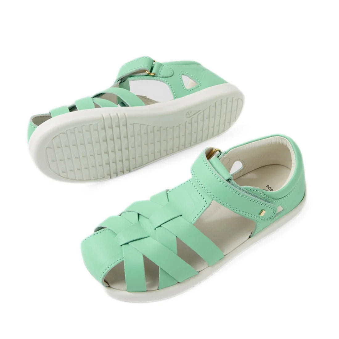 A pair of Bobux Kids Plus KP Tropicana II Jelly Mint Quick Dry Sandals in mint green kid leather, featuring strappy uppers and white soles. Inspired by the iconic Bobux Tropicana style, one sandal is shown from the side, while the other reveals a textured