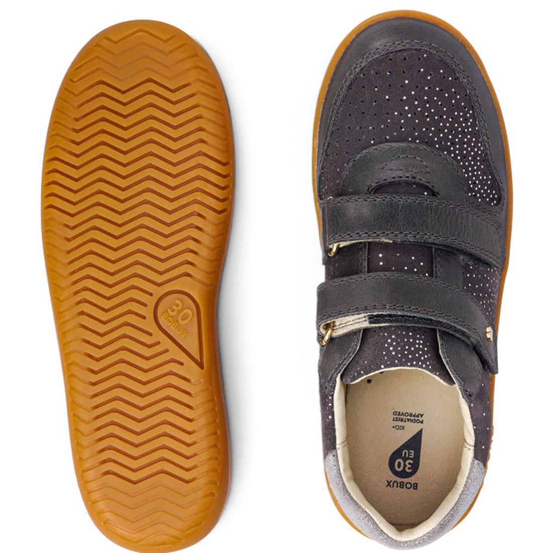 The Bobux Kids Plus KP Sprite Sneaker in Charcoal Grey features a tan, zigzag sole and a dark upper with two velcro straps and white speckles—ideal unisex shoes for children in winter 2023., 9420071316724, 9420071316731, 9420071316748, 9420071316755, 2833