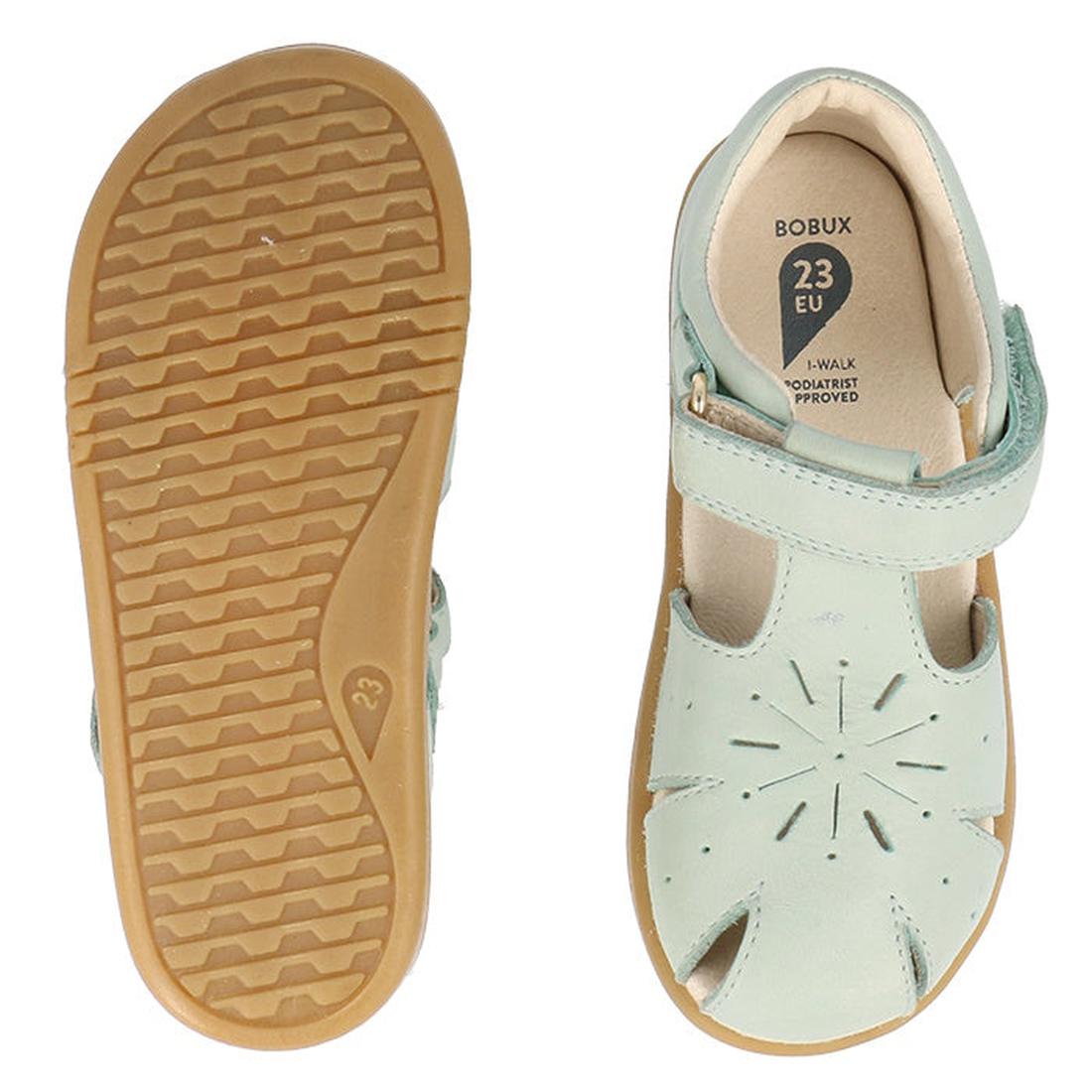 A pair of Bobux Iwalk IW Compass Kids Mist Blue Leather Sandals (641205) with closed toes, a Velcro strap, tan rubber soles, and star cut-out detail. One sandal is shown from the top; the other displays the bottom tread., 9420075708464, 9420075708471, 942