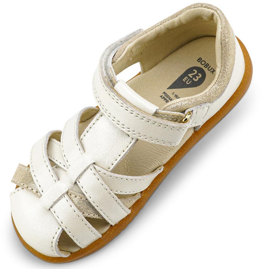 The Bobux iwalk Cross Jump Sandal Moon Pearl Closed Toe 636708 is a white kids' sandal with woven leather straps, a hook-and-loop closure, tan suede heel lining, and a light brown rubber sole. Insole size shown is 33 EU., 9420068516335, 9420068516342, 942