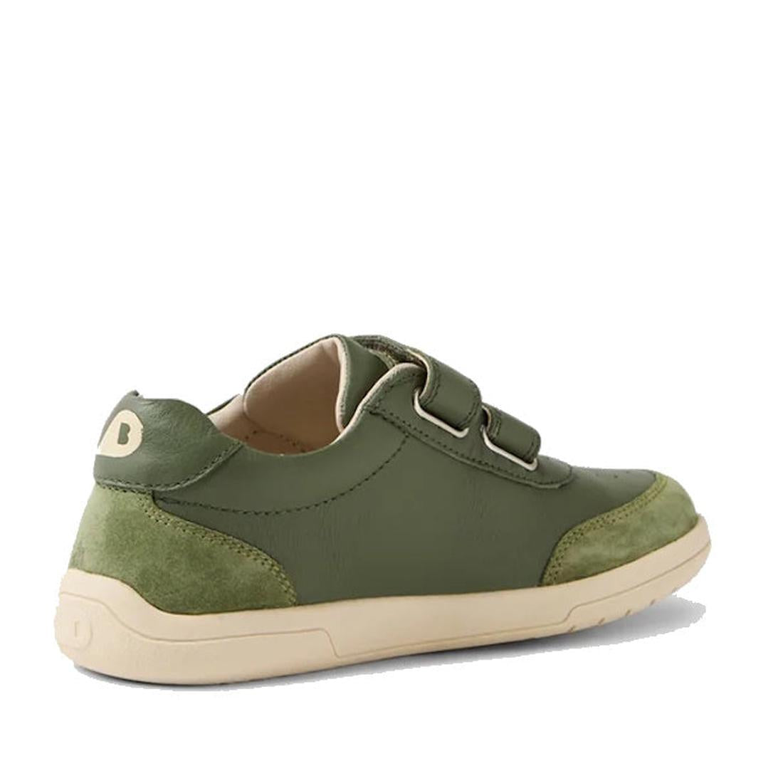 The Bobux KP Kids Plus Champ II Sneaker in Bronze Green Juniors features green leather, a beige durable sole, two adjustable straps, and suede heel and toe caps, shown angled on a white background., 9420074829573, 9420074829580, 9420074829597, 94200748296