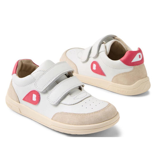 The Bobux KP Kids Plus Champ II Sneaker White Raspberry Juniors features white leather, beige suede accents, pink details, a flexible sole, and adjustable velcro straps. One shoe faces forward; the other shows the back and side.