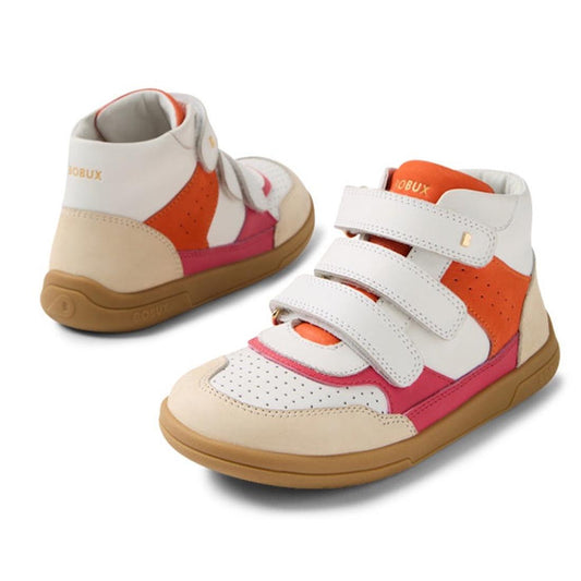The Bobux KP Kids Plus Harley Ankle Leather Boot in Radiant Raspberry for juniors features white, tan, orange, and pink panels, perforated toes, adjustable straps, and a durable gum sole, shown against a white background.