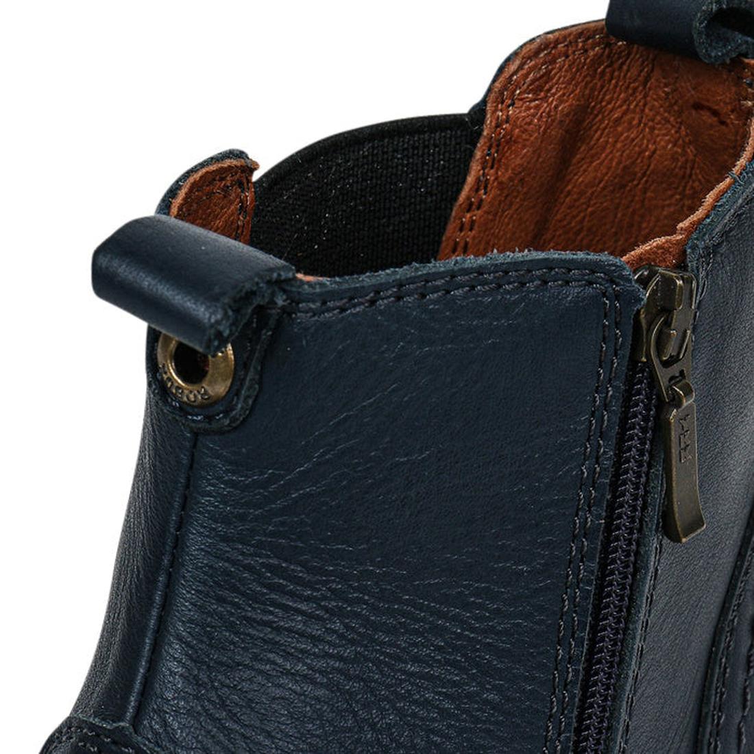 Close-up of the top part of the Bobux Kid+ Jodphur Leather Boot Navy Blue 830007Z, featuring brown lining, side zipper, pull tab, and detailed stitching—showcasing its premium texture and craftsmanship., 9420075720930, 9420075720947, 9420075720954, 942007