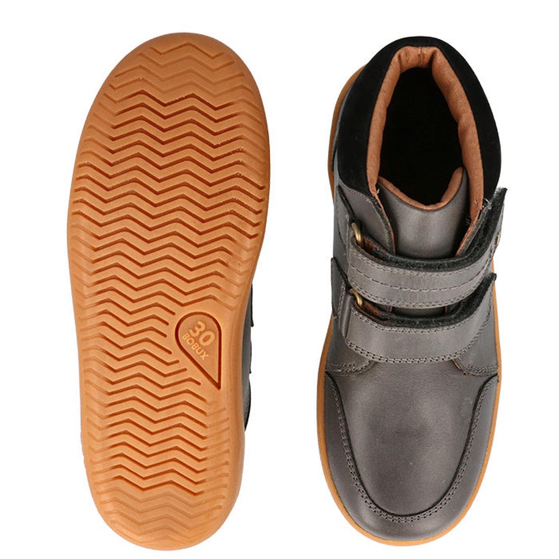 The Bobux Kid+ Timber Boot Charcoal 832924 features a gray upper with Velcro straps and a tan rubber sole with a chevron pattern—perfect first walkers boots, shown from above and below., 9420075797536, 9420075796652, 9420075796669, 9420075796539, 94200757