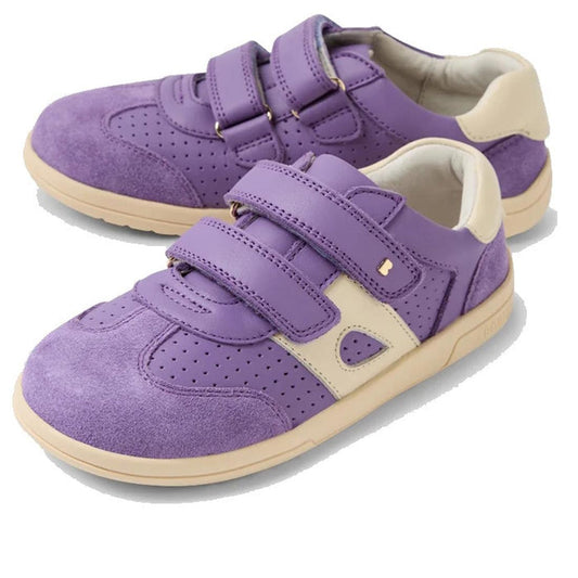 The Bobux KP Kids Plus Titan Juniors Leather Sneaker in Purple Haze features a purple leather upper with beige accents, adjustable hook-and-loop straps, perforated details, and a flexible beige rubber sole.