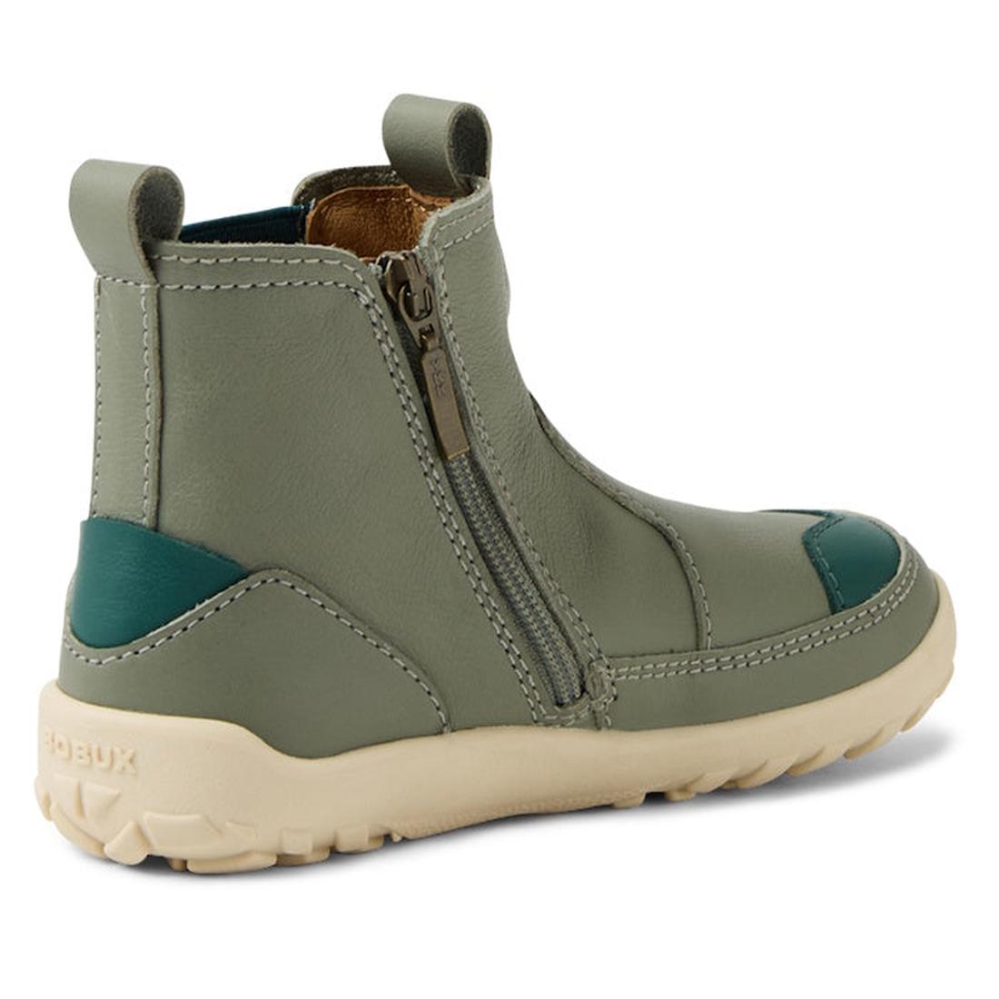 The Bobux KP Kids Plus Trail Leather Boot Juniors Vetiver Green Alpha features sage green leather, a barefoot-shaped toe box, side zipper, beige rubber sole, teal heel and toe accents, plus visible stitching., 9420074824219, 9420074824226, 9420074824233, 