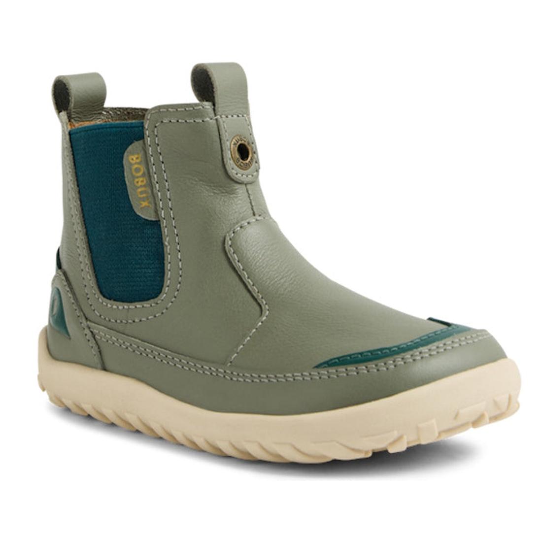 The Bobux KP Kids Plus Trail Leather Boot Juniors Vetiver Green Alpha is a sage green kids’ leather boot with a cream zero-drop sole, blue elastic side panel, barefoot toe-box, pull tabs, visible stitching, and yellow BOBUX branding., 9420074824219, 94200